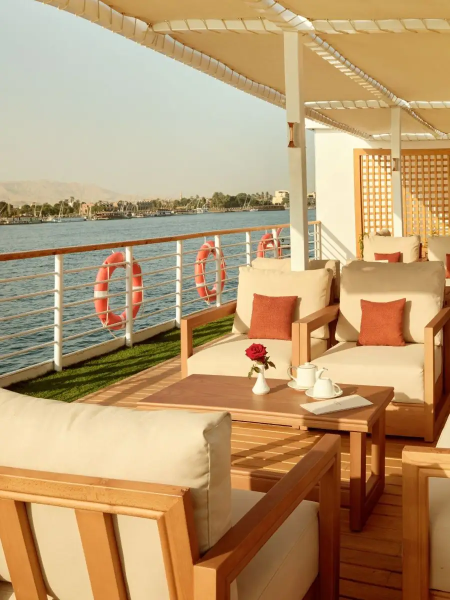 Guests relaxing on the accessible sun deck of a luxury Nile cruise